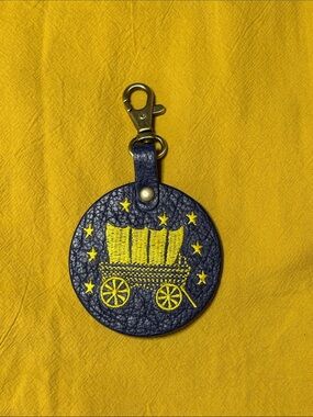 Portland Leather Goods Cobalt Blue with Yellow Covered Wagon Accent Purse Charm